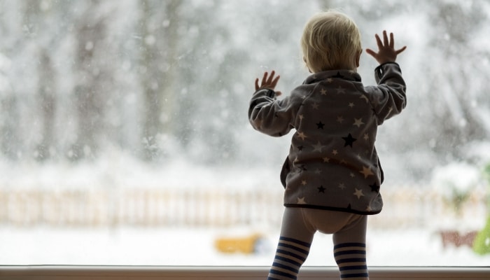 Child Looking At Snow