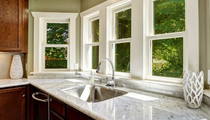 Kitchen With Steel Sink And Windows